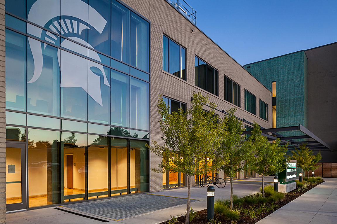Flint Journal Building with the white Spartan head logo on the windows